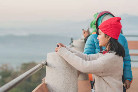 LAMPHUN THAILAND - DECEMBER 9 :  Unidentified tourists taking pictures and selfies while the sunrise...
