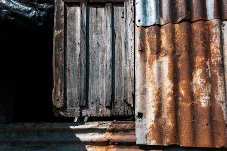 Old and rusty zinc sheet wall. Vintage style metal sheet roof texture. Pattern of old metal sheet. Rusting metal or siding. Corrosion of galvanized. Background and textures in retro concept.の写真素材