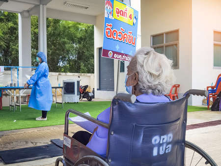 KANCHANABURI, THAILAND-AUGUST 25,2021 : Unidentified people wait in a queue to take first dose of...