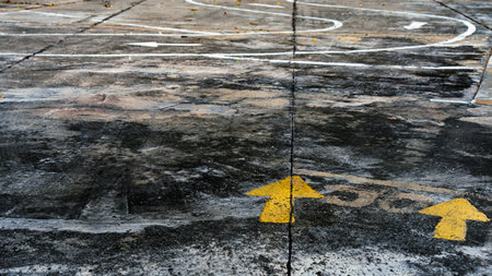 Driving test and training area with simulate test for driving license. Driving school practice traffic area with pole signs and orange cones and road signs for safety on concrete road. Selective focus.の写真素材