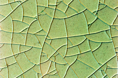 Close up to background and texture of stretch marks cracked on emerald green glazed tile. Scratches...