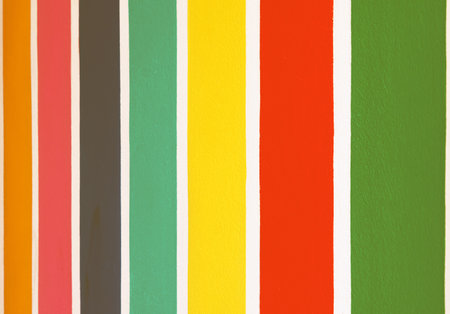 Multicolor vertical striped pattern on cement wall. Colorful painted on cement surface of the wall. Graffiti in the colors of rainbow. Colour full of wall. Color fence, Multi-colored concrete fence.の写真素材
