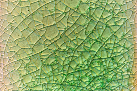 Close up to background and texture of stretch marks cracked on emerald green glazed tile. Scratches...