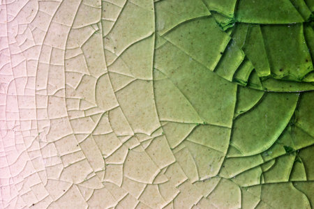 Close up to background and texture of stretch marks cracked on emerald green glazed tile. Scratches background. Vintage scratched grunge tile broken screen texture. Scratched glass surface wallpaper.の写真素材