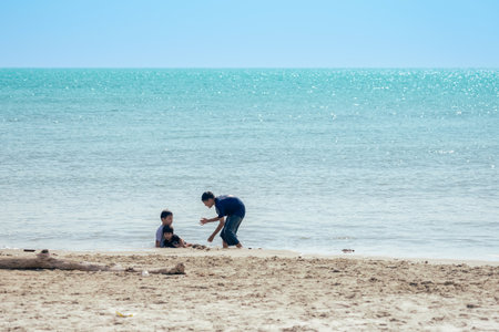 PHETCHABURI-THAILAND,DECEMBER 31 ,2022 : Unidentified Three Asian boys from same family having fun...