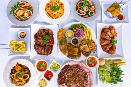 Delicious variety of steak and spaghetti with trimmings, fried Chicken with Sauce,fried fish,french...