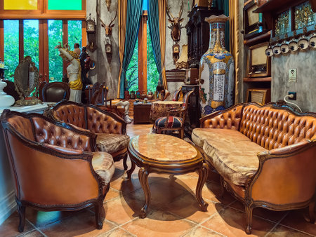 NAKHON SI THAMMARAT, THAILAND - NOVEMBER 26,2023 : The interior of cafe decorated with beautiful antique collectibles and comfortable seats perfect for relaxing with delicious coffee at 8 OCT. CAFE.のeditorial素材