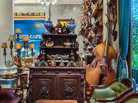 NAKHON SI THAMMARAT, THAILAND - NOVEMBER 26,2023 : The interior of cafe decorated with beautiful antique collectibles and comfortable seats perfect for relaxing with delicious coffee at 8 OCT. CAFE.のeditorial素材