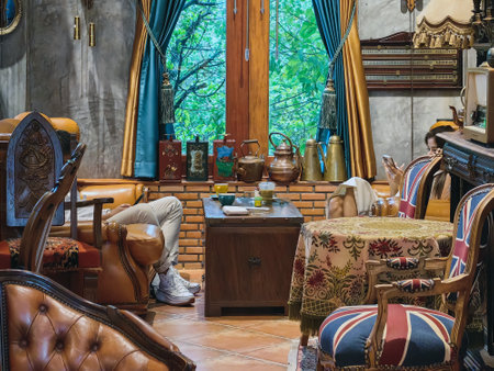 NAKHON SI THAMMARAT, THAILAND - NOVEMBER 26,2023 : The interior of cafe decorated with beautiful antique collectibles and comfortable seats perfect for relaxing with delicious coffee at 8 OCT. CAFE.のeditorial素材