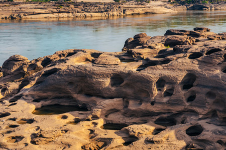 Grand Canyon in Thailand, Nature of rock canyon in Mekong River, Dry rock reef in the Mekong River with mountain hills. View of Sam Phan Bok is called Valley of Thailand. Nature landscape background.の写真素材