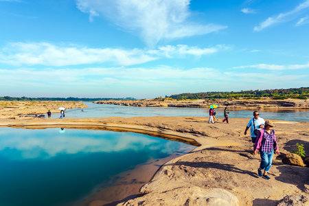 UBON RATCHATHANI, THAILAND-DECEMBER 9,2023 : Unidentified tourists enjoy sightseeing at Sam Phan Bok near Mekong River is called Valley of Thailand. Grand Canyon in Thailand. Beautiful landscape view.のeditorial素材