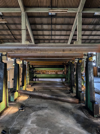KANCHANABURI, THAILAND - FEBRUARY 2,2024 : Interior view of antique material, equipment, tools, and technology inside a former World War II era old paper mill (New Historic Landmark of Kanchanaburi).のeditorial素材