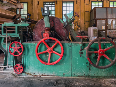KANCHANABURI, THAILAND - FEBRUARY 2,2024 : Interior view of antique material, equipment, tools, and technology inside a former World War II era old paper mill (New Historic Landmark of Kanchanaburi).のeditorial素材