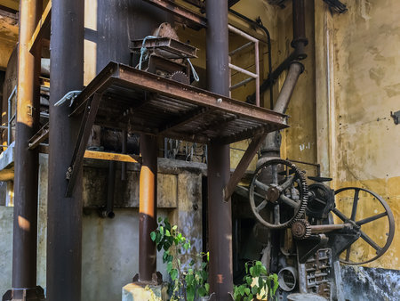 KANCHANABURI, THAILAND - FEBRUARY 2,2024 : Interior view of antique material, equipment, tools, and technology inside a former World War II era old paper mill (New Historic Landmark of Kanchanaburi).のeditorial素材