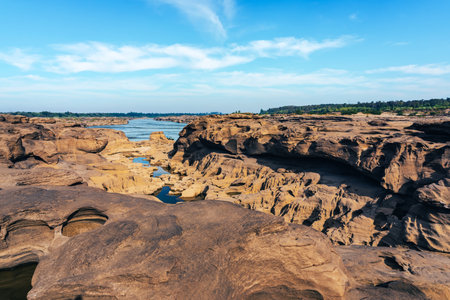 Grand Canyon in Thailand, Nature of rock canyon in Mekong River, Dry rock reef in the Mekong River with mountain hills. View of Sam Phan Bok is called Valley of Thailand. Nature landscape background.の写真素材