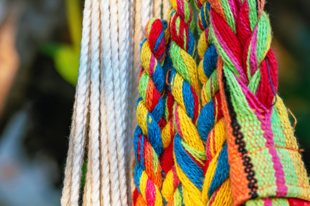 Colorful cotton rope. Thick cotton rope showing detail of threads and fibres. Yarn braid rope of...