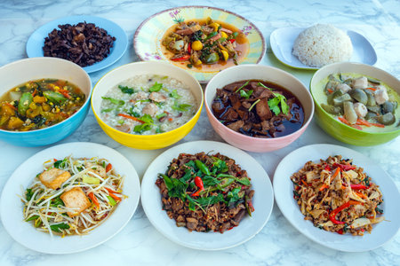 Set of dishes for healthy food on marble background. Vegetarian food concept. Set of healthy vegetarian food. Vegetables, fruit, seeds, cereals, beans, spices, superfoods, herbs, Condiment for vegan.の写真素材