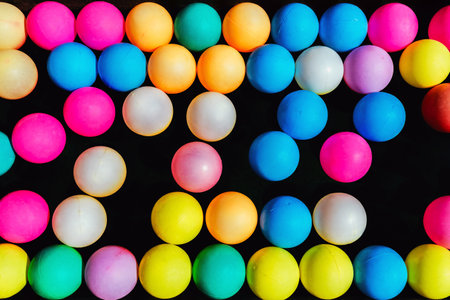 Top view of many colorful plastic balls on water. View of colored sponge balls. Many colorful balls as background. Lots of colorful balls for children to play in the water park. Toy pool for kids.の写真素材