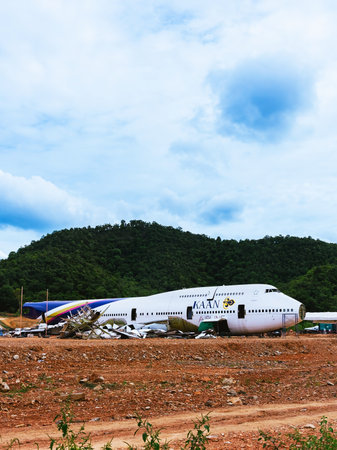 KANCHANABURI,THAILAND-SEPTEMBER 6,2024 : Construction of new cafe and restaurant using an old commercial airplane from Thai Airways to renovation for a new beautiful landmark surrounded by mountains.のeditorial素材