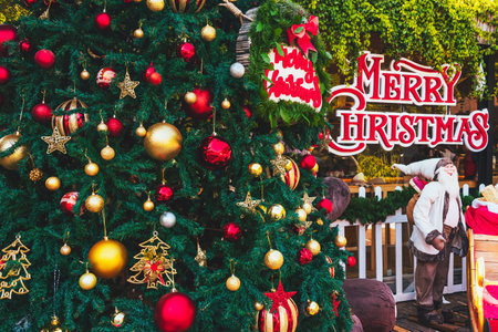 Decorative multicolored balls and Christmas tree. Christmas tree decorated with shiny colorful balls...