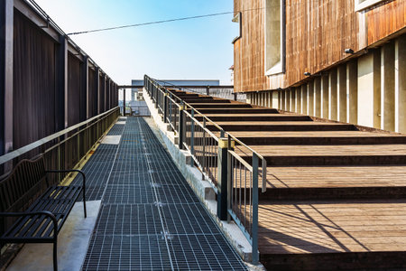 Beautiful modern architecture concept design of wooden stair and handrail with surface texture at walking entrance of modern exhibition hall building. Beautiful wooden staircase.の写真素材