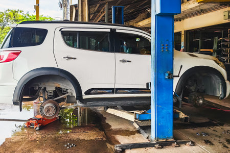 Change new car tires. Process of checking the condition of new tires. Repair tire puncture. Checking and filling air pressure. Car repairs. Car breakdowns. Concept of car tire maintenance and repairの写真素材