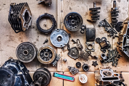 Old parts of motorcycles background. Repair and maintenance old parts of engine. Old motorcycle...
