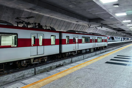 Electric underground tram with cables connected to upper carriage. Metro underground train. Tram...