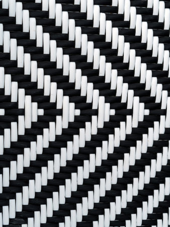 Black and white woven rattan pattern texture. Geometric zigzag weave pattern of synthetic wicker....
