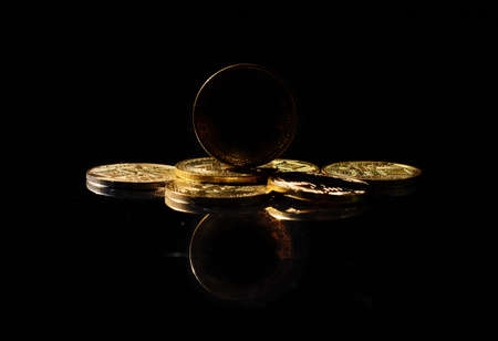 Dark altcoin on market. New cryptocurrency on a top of coins against black mirror surface. Black crypto token. Noname or nameless coin. Independent stablecoin. Alternative type of digital asset.の写真素材