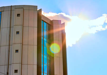 City real estate. Urban mall office architecture. Modern business house with metallic facade...