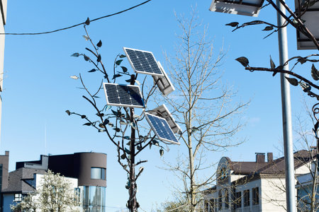 Innovative eco-friendly solution for harnessing power of the sun. Renewable energy in the city. Efficient solar panels and modules for commercial use, public spaces, street lighting, park illuminationの写真素材