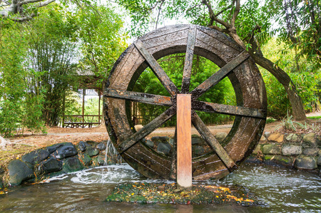 Wooden Wheel of Ancient Water Mill in Villageの写真素材
