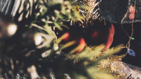 Christmas tree decoration with red and gold baubles. Selective focus.の写真素材