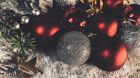 Christmas decoration with red and golden baubles on rustic backgroundの写真素材