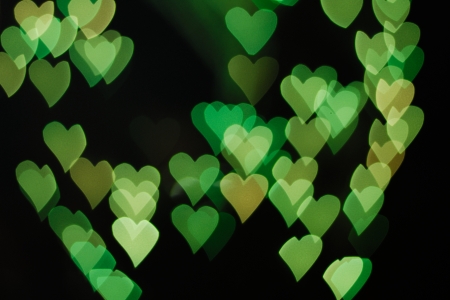 green heart shape by defocusing lightの写真素材