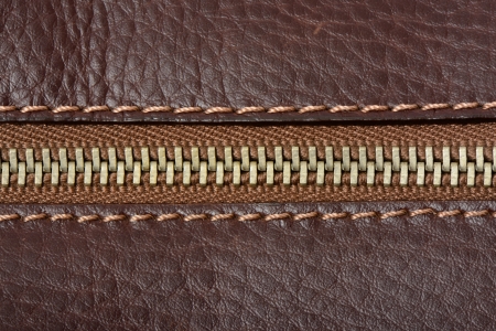 Brown leather texture and zipper backgroundの写真素材