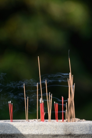 burning joss sticks in Buddhist templeの写真素材
