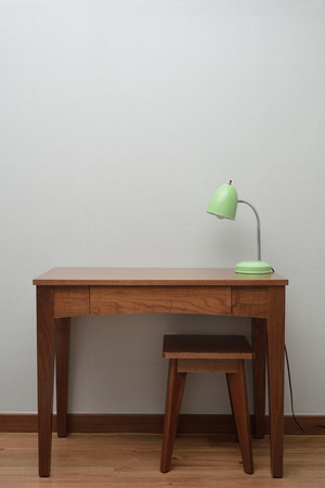 wooden Brown Table with a Lamp in bedroomの写真素材