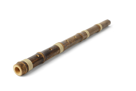 Korean traditional instrument called Danso, isolated on whiteの写真素材