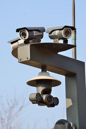 closeup of three Infrared CCTV surveillance camerasの写真素材