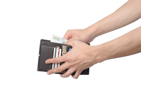 side view of taking some bills out of a wallet