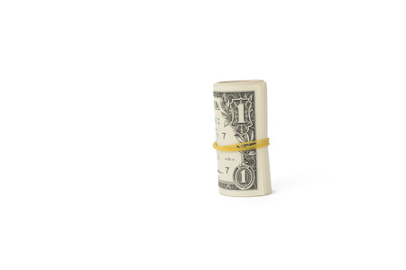 roll of dollar bills, isolated on whiteの写真素材