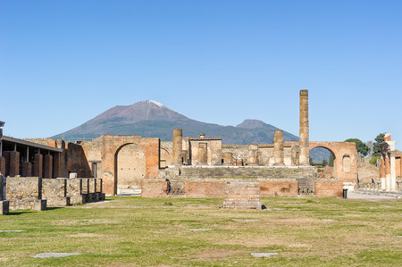 Ruined Temple of Jupiter with mount vesuvio in Pompeii. Pompeii is a ruin of acient Roman City near Naples in Italy.の写真素材
