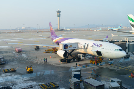 INCHEON, KOREA - DECEMBER 28, 2012: Thai air flight at the Incheon International Airport in Korea.のeditorial素材