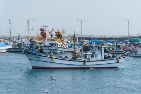 Jeju-do, Korea - April 10, 2015: fishing boat at the Moseulpo port, famous place for passenger terminal to Gapado Island.のeditorial素材