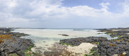 Woljeongri beach in Jeju Island, Korea. Woljeong beach is famous for white sand and beautiful scenery. And there are many beautiful cafes along the Woljeongri coast road.の写真素材
