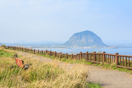 Landscape view from Olle trail No.10 at Songaksan course in Jeju island, Korea. Sanbangsan is a famous volcanic mountain in Seogwipo-si in Jeju.の写真素材