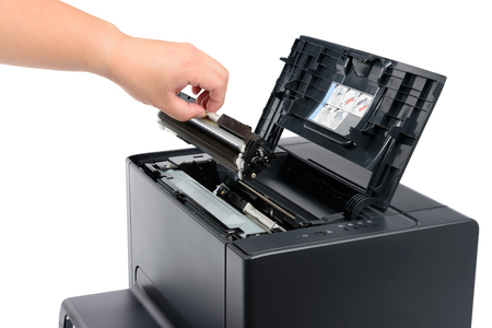 replace black toner cartridge in a laser printer, isolated on whiteの写真素材