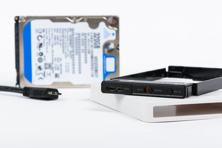 components of External Enclosure case and 2.5 inch Hard Disk Drive on a white background